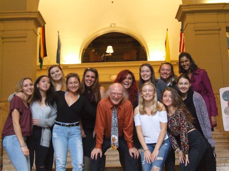 group photo of Kevin Ahern with female students in Memorial Union entryway