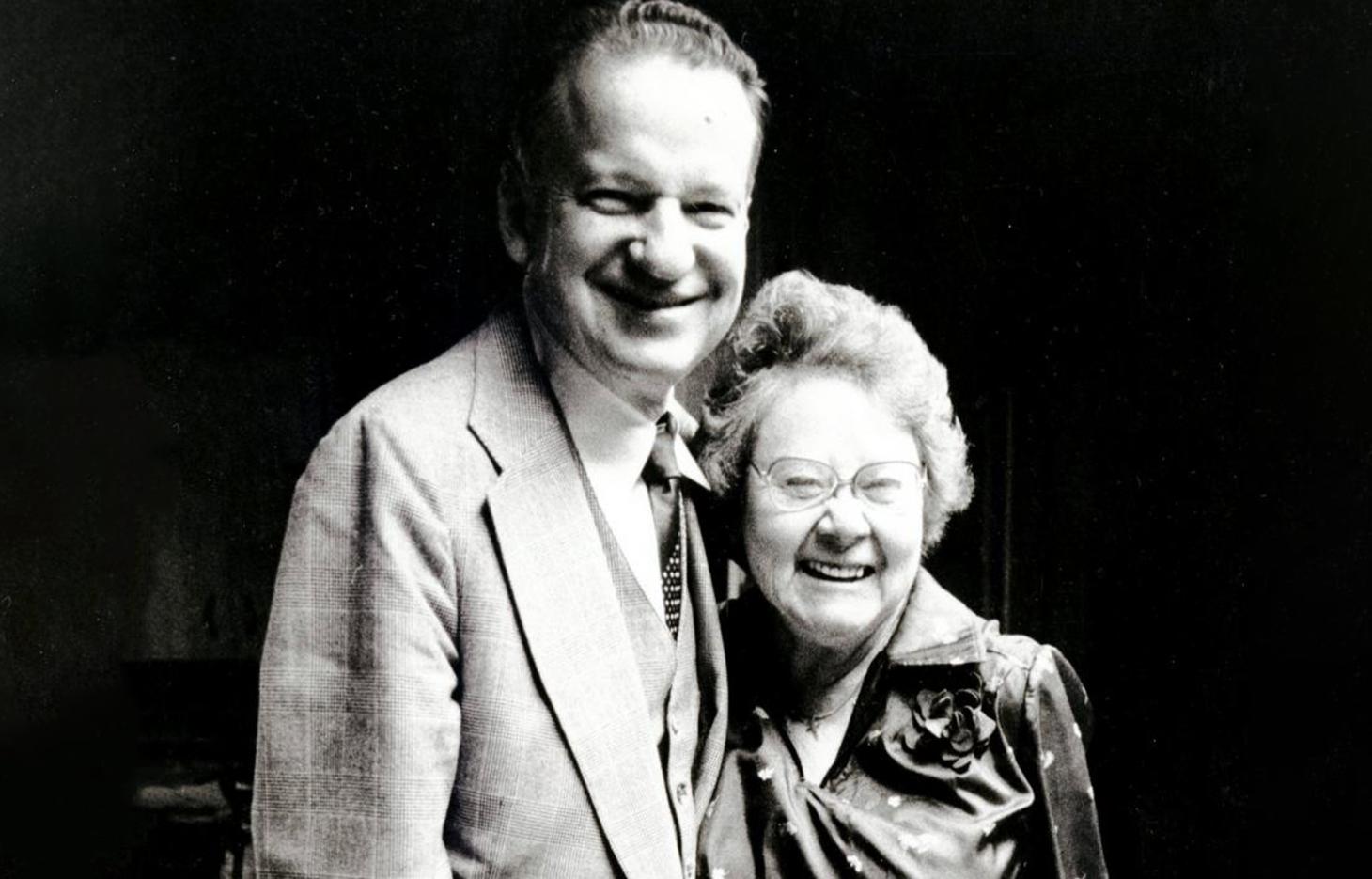 Robert and Clarice MacVicar, hugging each other in a black and white photograph.